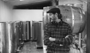 Dylan Sheldon Winemaker in the Cobble Hill barrel room